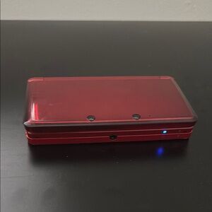 Nintendo Red Handheld Console with Dual-Screen Design